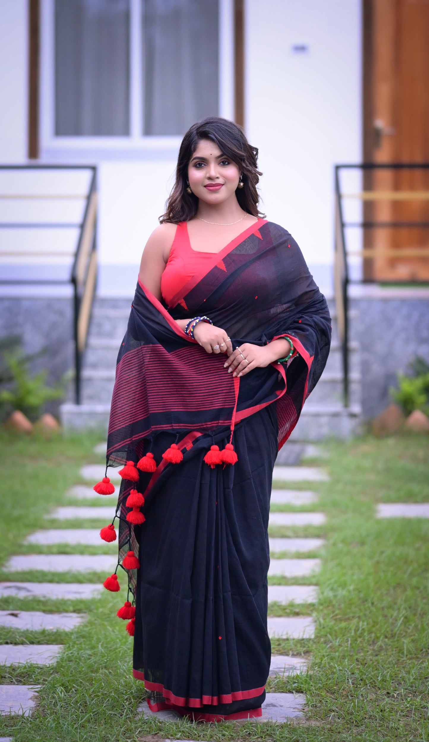 Elegant Black Cotton Saree with Red Detailing and Matching Blouse Piece