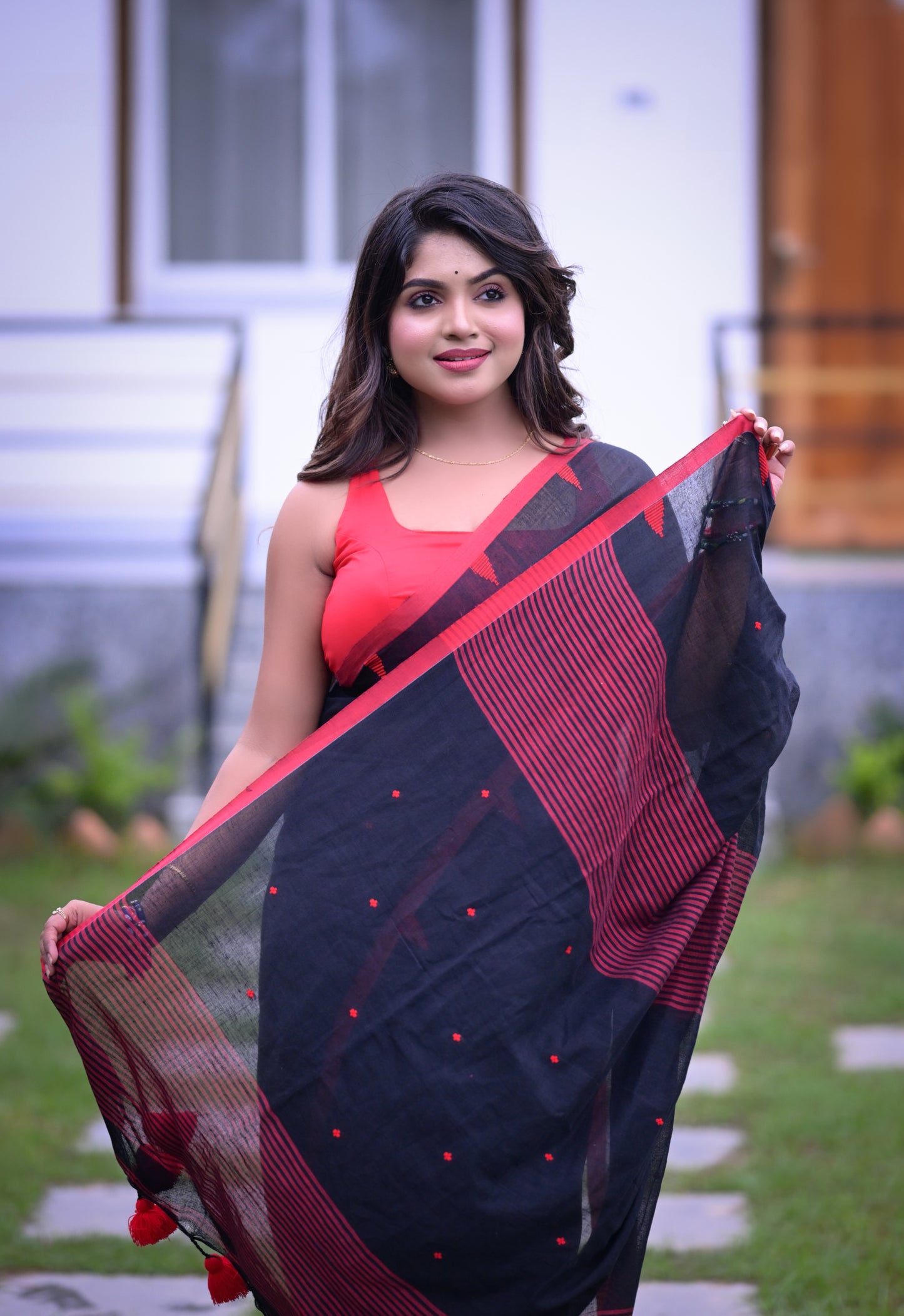 Elegant Black Cotton Saree with Red Detailing and Matching Blouse Piece