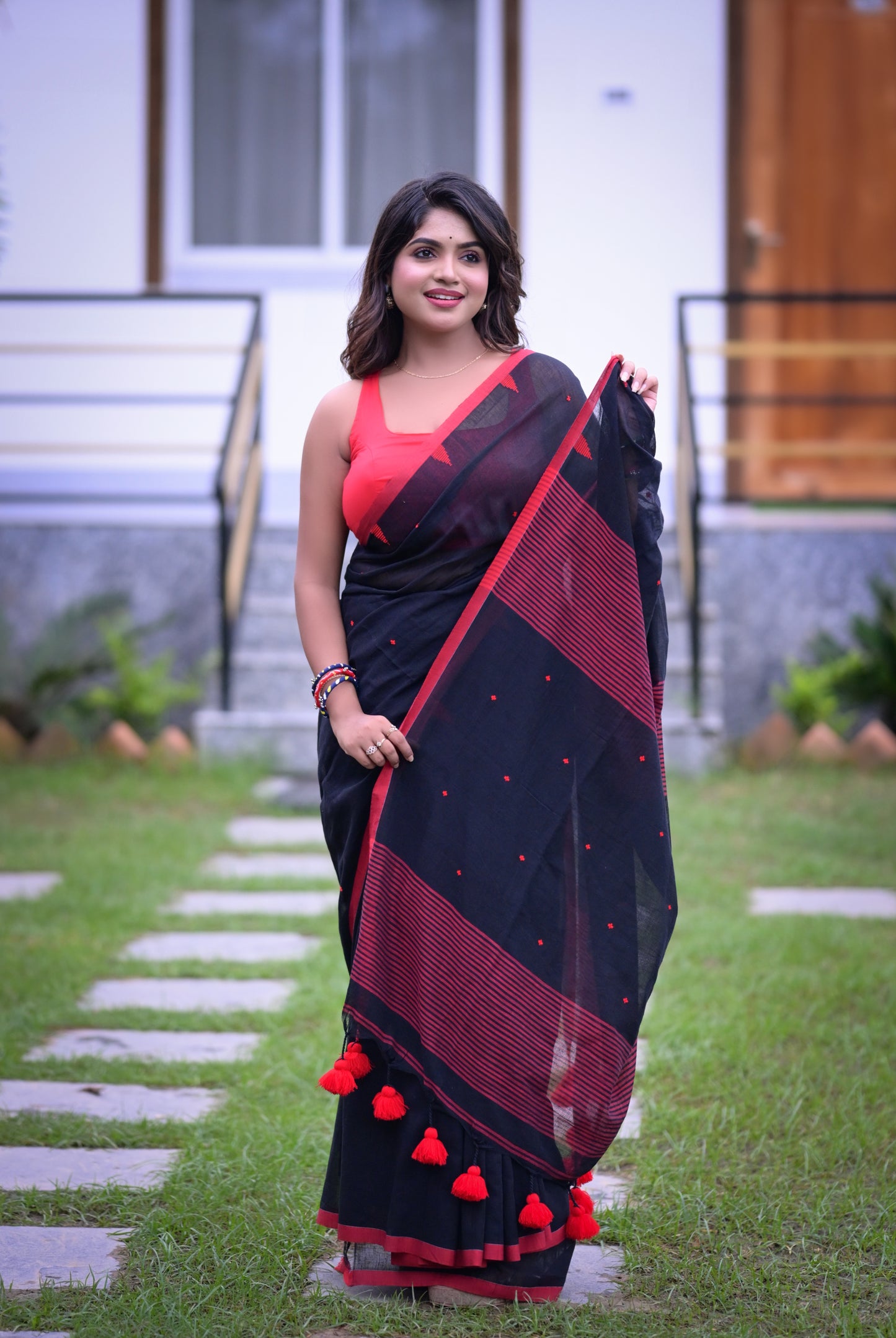 Elegant Black Cotton Saree with Red Detailing and Matching Blouse Piece