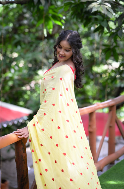Yellow Mull Cotton Saree with Red Heart Design – Soft & Lightweight (Blouse Not Included)